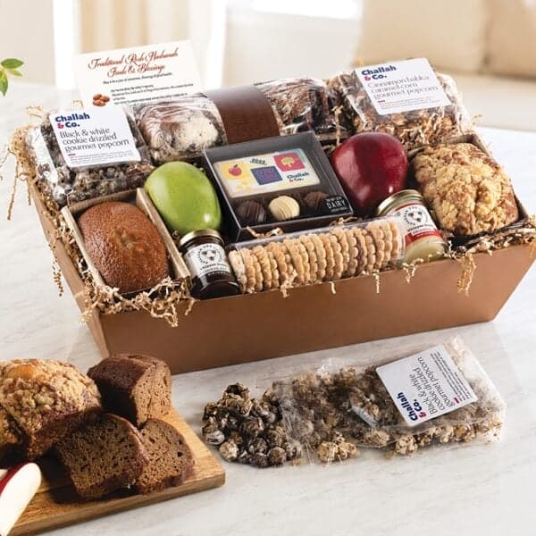 Large Shana Tova gift basket with honey cakes, babka, and sweets